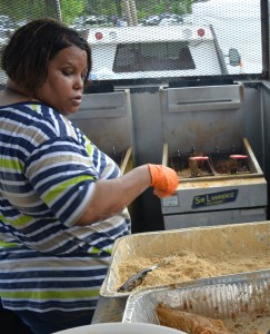 Stephanie Terrell frying up chicken at the Gordonsville Fried Chicken Festival. Photo by Lauren Ober. 